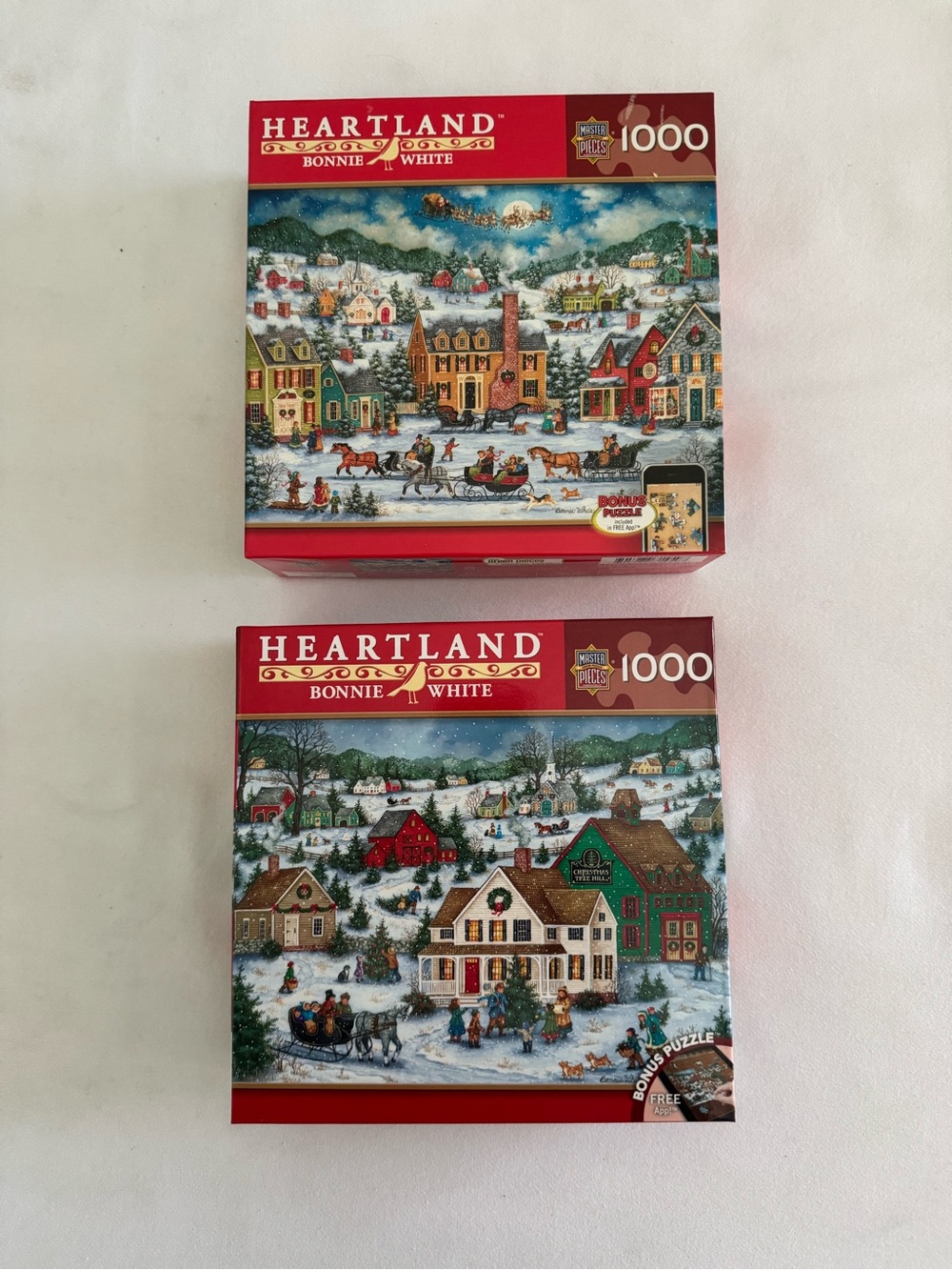 2 NWT 1000 piece Heartland Christmas puzzles by Bonnie White.